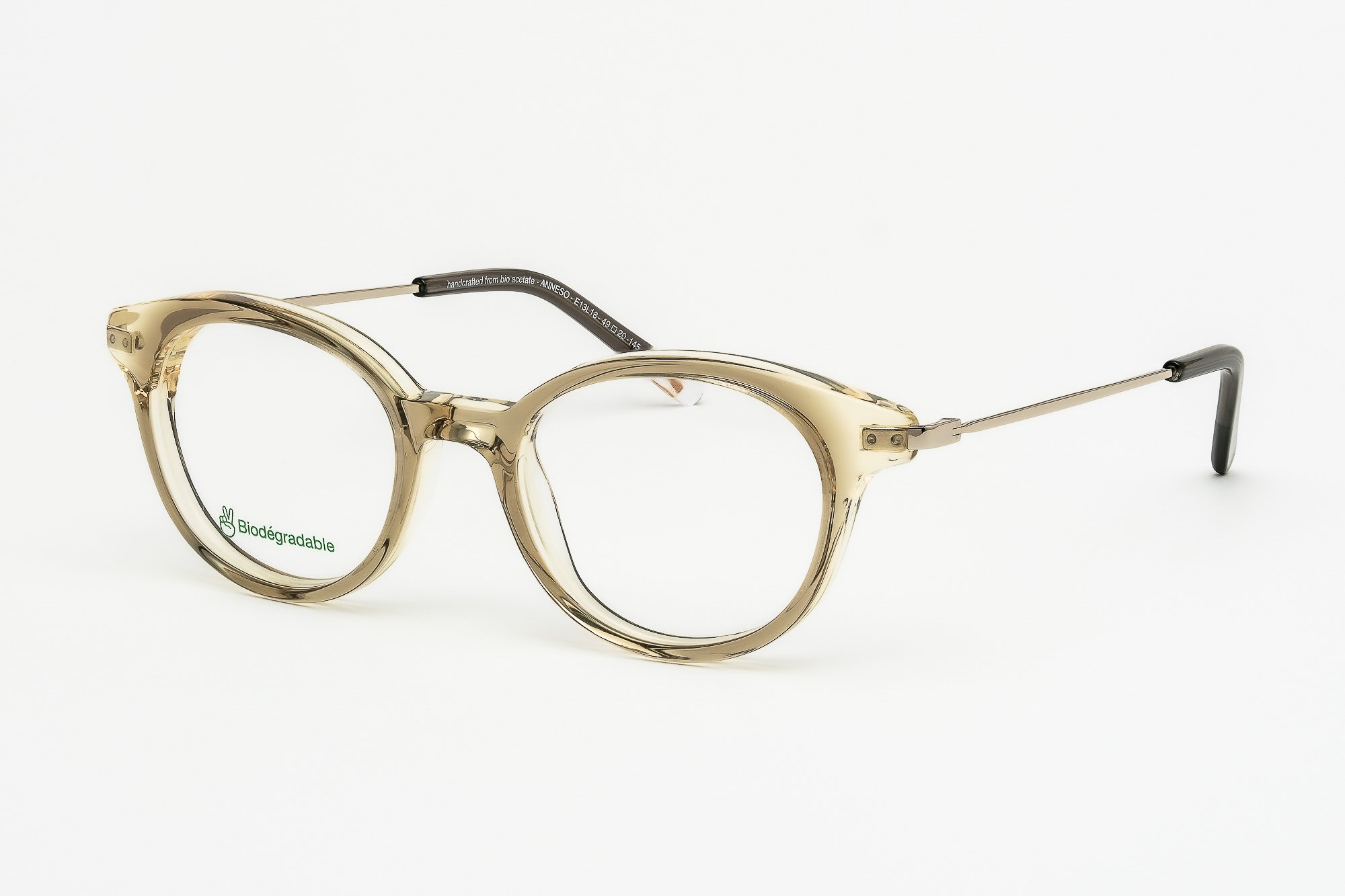 Anne So E13L18 — Monture optique ronde en acétate ambre rosé. Douceur et lumière naturelle.