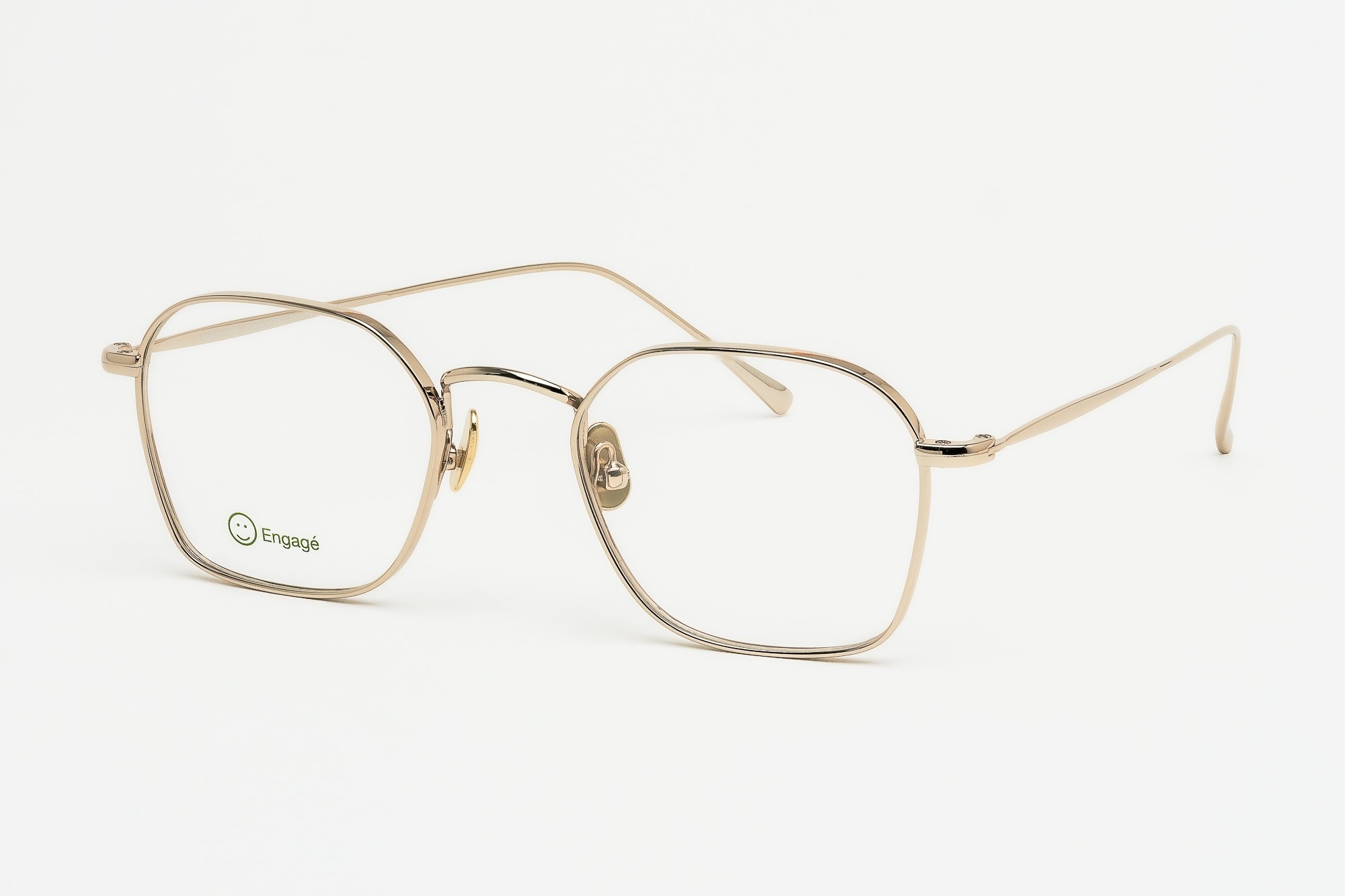 Jono PG — Monture optique en métal or pâle. Précision et éclat discret.